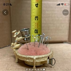 Seamstress pin cushion with tape measure and thimble